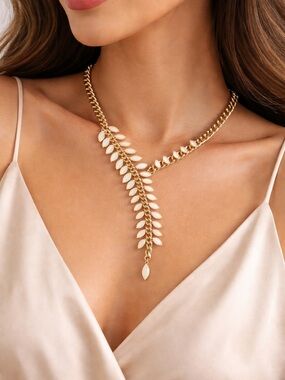 Gold colored chain with beige stones